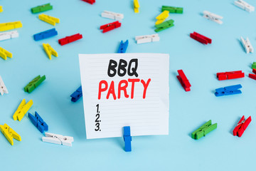 Word writing text Bbq Party. Business photo showcasing usually done outdoors by smoking meat over wood or charcoal Colored clothespin papers empty reminder blue floor background office pin
