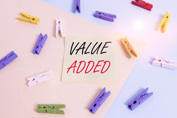 Word writing text Value Added. Business photo showcasing the extra value created over and above the original value Colored clothespin paper empty reminder yellow blue floor background office