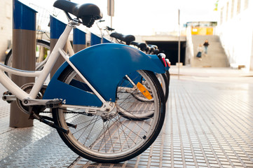 blue rental bicycles with blue advertising space