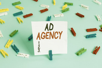 Word writing text Ad Agency. Business photo showcasing business dedicated to creating planning and handling advertising Colored clothespin papers empty reminder blue floor background office pin