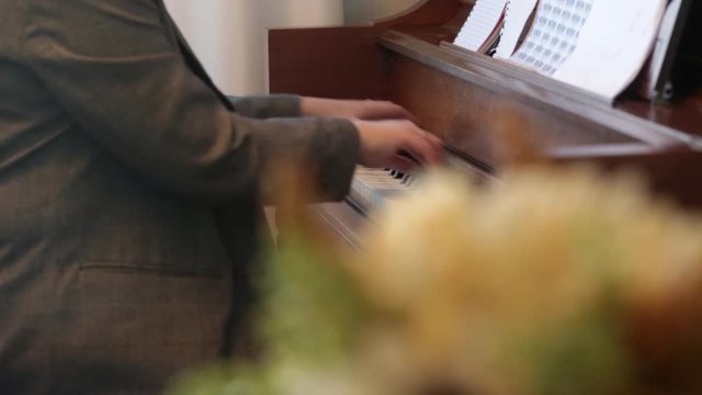 Beautiful European  woman playing piano. selective focus.