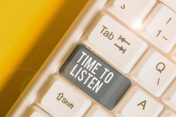 Conceptual hand writing showing Time To Listen. Concept meaning Give attention to someone or something in order to hear White pc keyboard with note paper above the white background