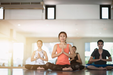 Exercising with yoga  in the room. Yoga classroom.