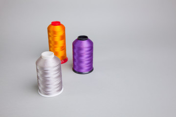 sewing thread. a multicolored thread standing on it. Can write in space of margin