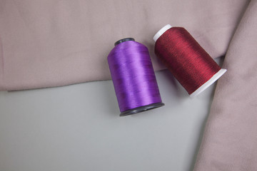 thread placed on a fabric. reclining variegated yarn-dyed.