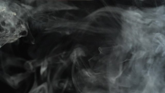Realistic Smoke Clouds Fog flies through the frame. Good footage for effects and transitions. Smoke cloud on black isolated background