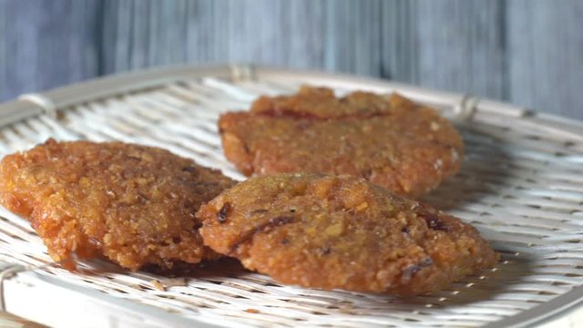 Cinematic closed up shot of Vada (Vadai, Vadei) is a traditional South indians food. this Hot and spicy fritters are perfect as snacks and are hugely popular among malaysians