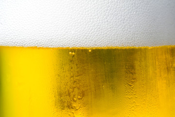 Background Cool beers with beer bubbles on top a glass at the party