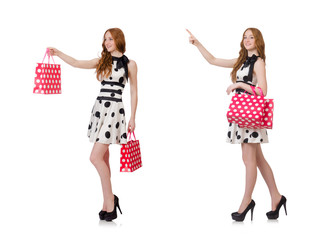 Young woman with shopping bags on white