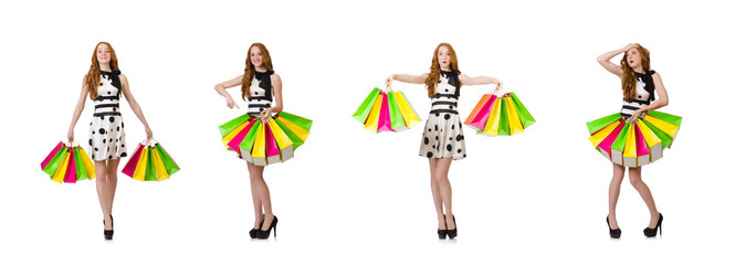 Young woman with shopping bags on white