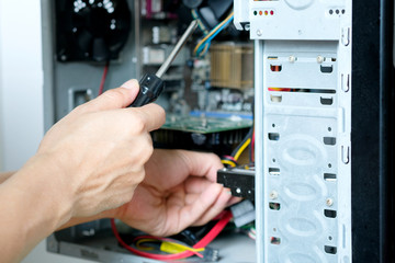 hands of a computer repairman He is checking the computer equipment. And will develop upgrades Computer with modern technology