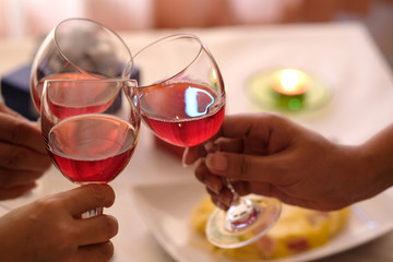 Hand of group friends celebrate successfully with red wine in the party. Young toasting in party and drinking after work hard for relax and be enjoy. Celebration Concept , Cheers!