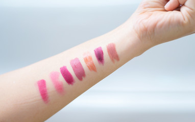Many woman like to test swatch different color lipstics on hand.