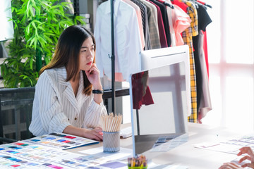 Asian women at work are fashion designers and tailors