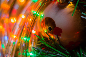 Christmas tree toy orange with a drawing of a duckling on the Christmas tree. Christmas garland for the new year. hanging balls