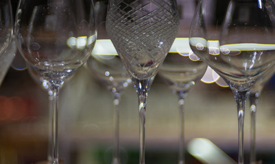 Glitter foot and stem of champagne glass in close range