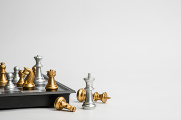 Chess leadership concept with gold and silver chess isolated in white background. Concept leader & success, strategy, business victory or decision