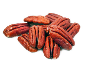 Peeled pecan nuts isolated on white background.