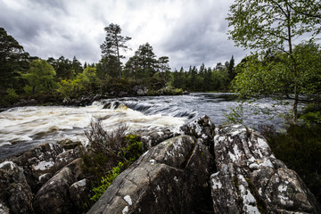 Picturesque landscape of a mountain river with traditional nature of Scotland.