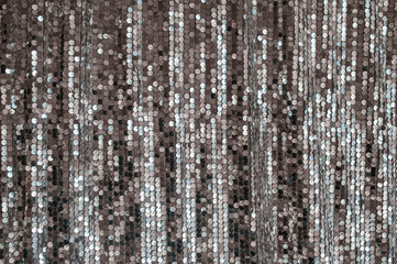 uniform silver fabric background with shiny sequins