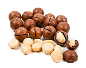 Macadamia nuts heap isolated on a white background.