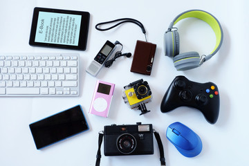 Many used modern Electronic gadgets for daily use on White floor, Reuse and Recycle concept, Top...
