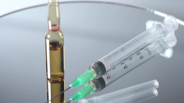 Closed up shot of an empty syringe with needle. used for blood taking and administered medications. Medical concept