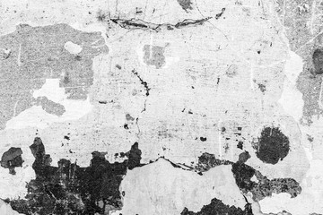 Texture of a concrete wall with cracks and scratches which can be used as a background