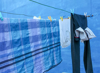 This is a picture of a clothesline with clothes dried on it.