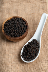 Fresh black cambodian pepper corn in bowl, cooking preparation