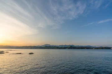 beautiful twilight sunset with blue sky high peak mountains mist fog green forest  park ocean sea idea for backpacker guiding backpacking camping campfire relax hiking  long weekend at Wakayama Japan