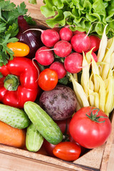 Fresh vegetables in wooden box as food containing vitamins. Healthy lifestyles and nutrition
