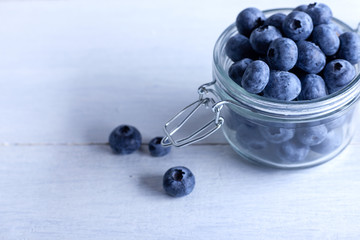 Beautiful blueberries in a glass jar.