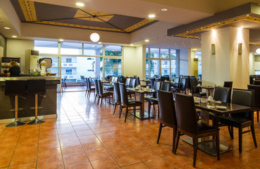 Oriental style interior of the japanese restaurant with nicely served table with napkins of the luxury five stars resort, hotel. Interior design.