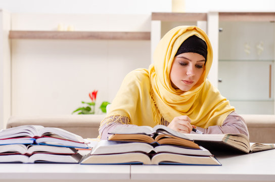 Female Student In Hijab Preparing For Exams