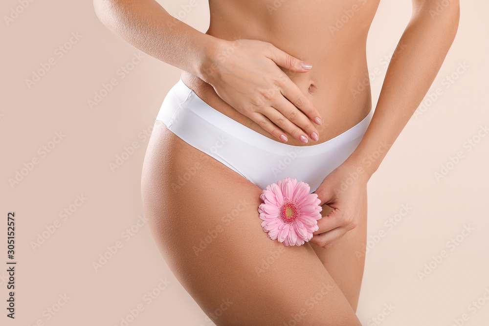 Poster Young woman with flower on light background. Gynecology concept