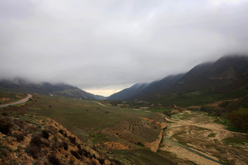 Obraz na płótnie Canvas Scenic misty mountain road in Dagestan view, Russia