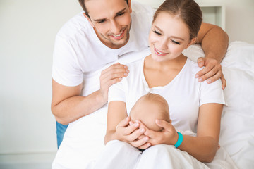 Fototapeta premium Young family with newborn baby in maternity hospital
