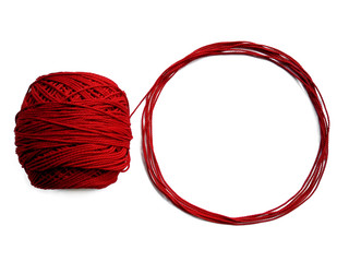 Red knitting yarn for handicrafts isolated on white background. Background of wool yarn, knitted...