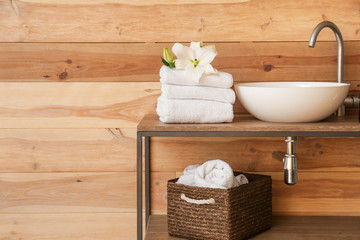 Clean towels near sink in bathroom