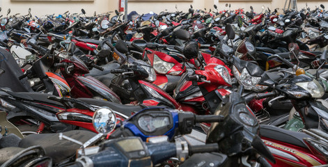 Street parking full of motorbikes in Vietnam