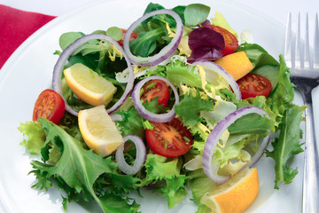 salad and raw vegetables on a plate