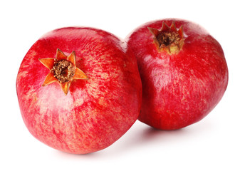 Ripe tasty pomegranates isolated on white