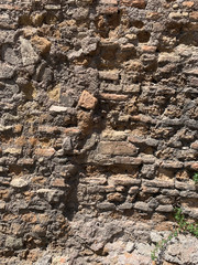 old antique stone ruined brown brick wall