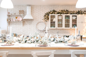 Beautiful table setting for Christmas celebration in kitchen