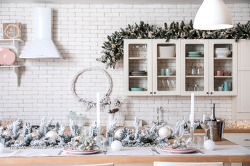 Beautiful table setting for Christmas celebration in kitchen
