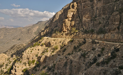 Fototapeta na wymiar Scenic mountain road in rocky landscape of Sultanate of Oman