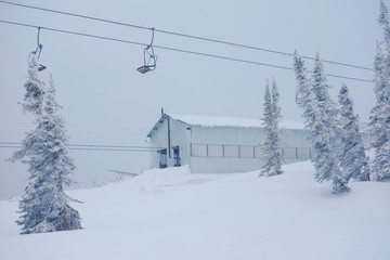 Funicular for tourists, skiers and snowboarders. lift to transport people in the mountains. the cable car on the background of blue mountains.