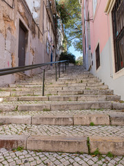 Stone stairs and cobblestones in an alley in Lisbon