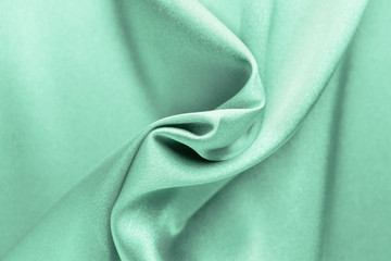 Fototapeta premium Texture of turquoise fabric, closeup